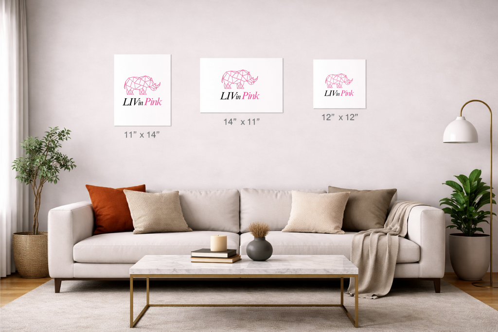 Living room with a sofa, coffee table, and decorative elements with framed prints on the wall.